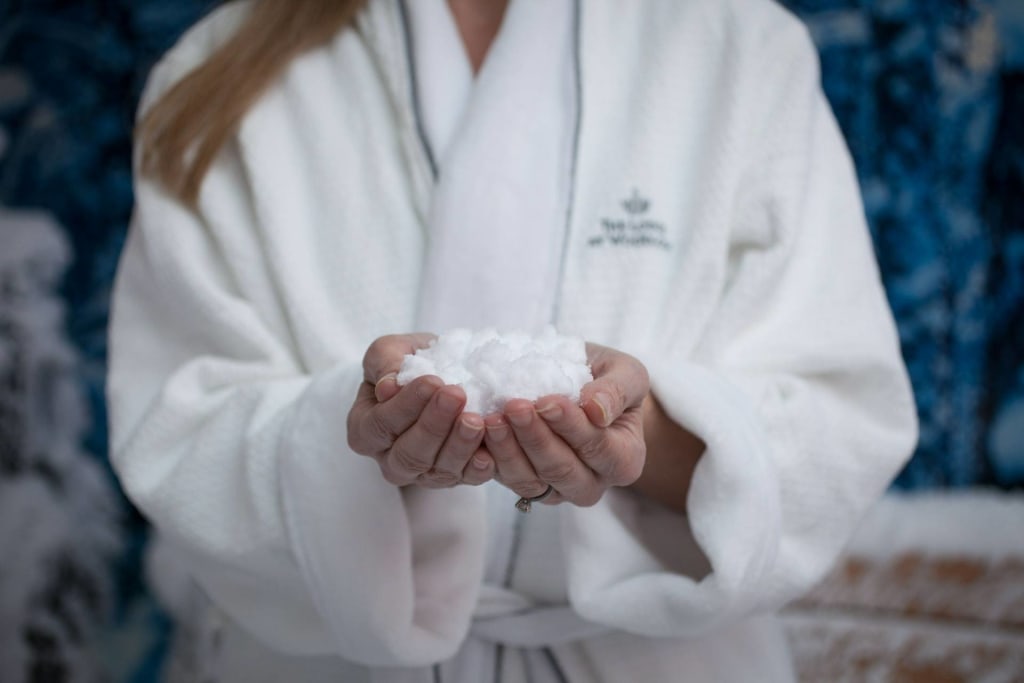 New spa amenity at The Lodge at Woodloch_Snow Room by TechnoAlpin- Guest Holding Snow